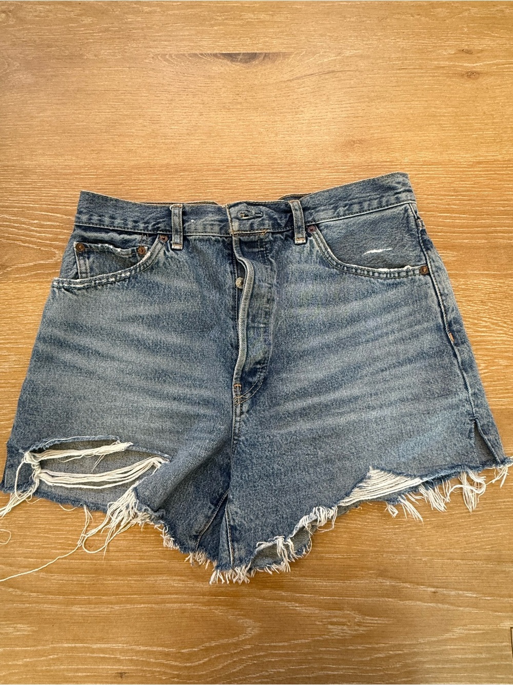 Re/Done Distressed High-Rise Denim Shorts in Light Blue